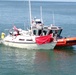 Coast Guard crew assists sailboat taking on water