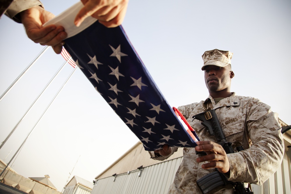 U.S. Marines raise the American flag over Camp Leatherneck