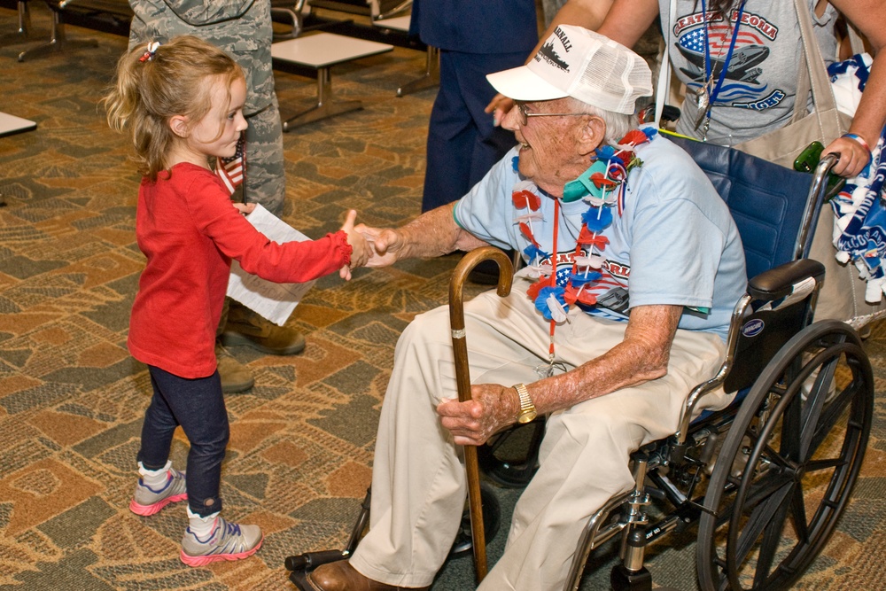 182nd Airlift Wing member salute generations past