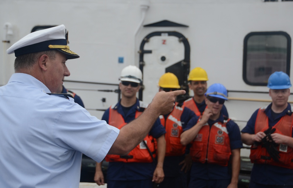 Rear Adm. Michael Parks welcomes the crewmembers of Coast Guard Cutter Morro Bay
