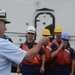 Rear Adm. Michael Parks welcomes the crewmembers of Coast Guard Cutter Morro Bay