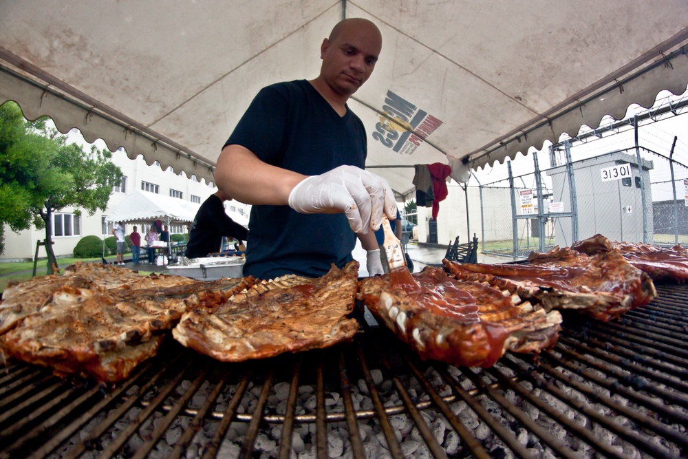 Senior leaders, families give back to barracks residents during block party