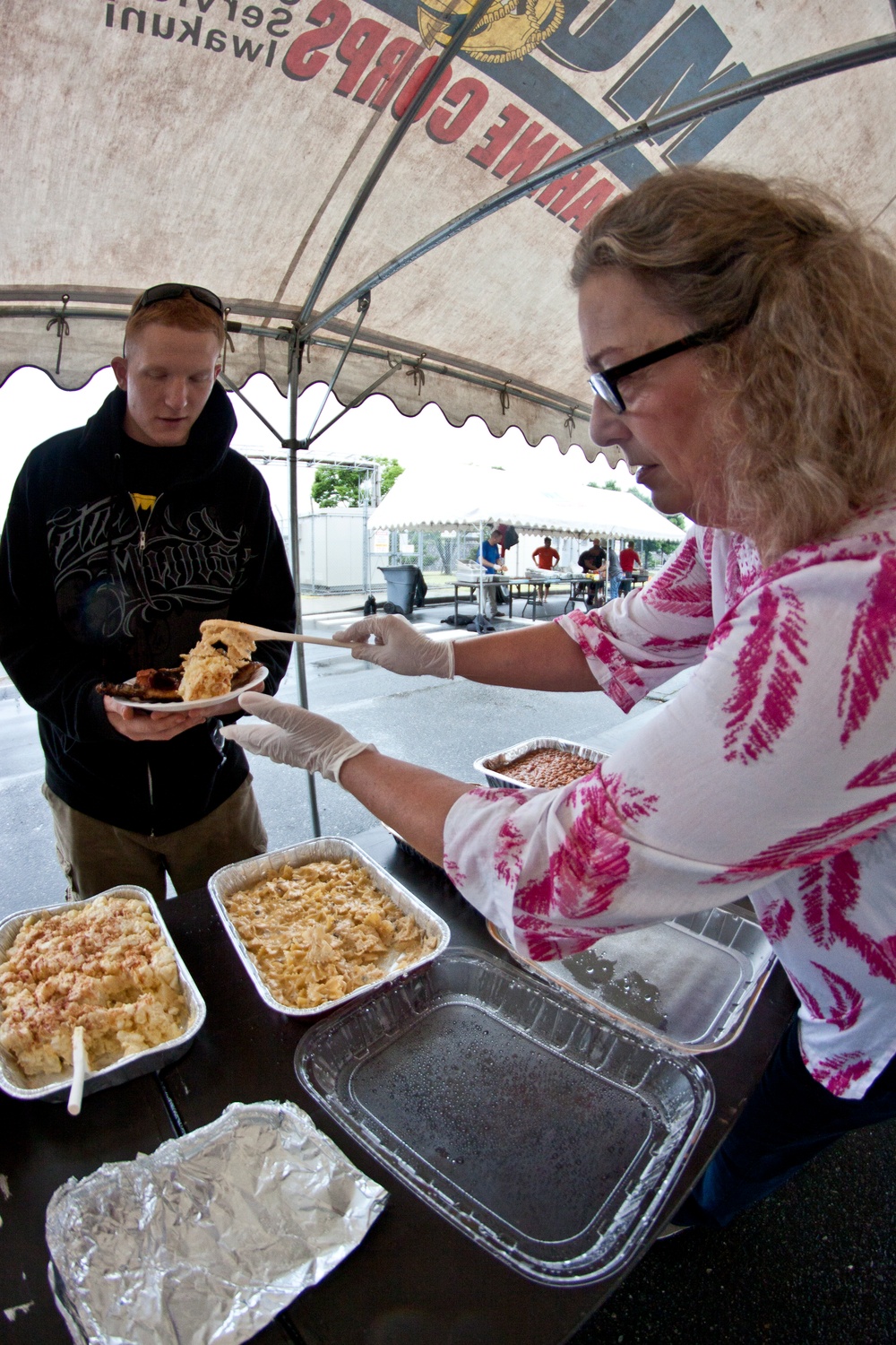 Senior leaders, families give back to barracks residents during block party