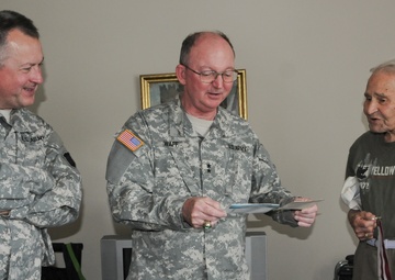 Army Reserve leaders bring birthday greetings to 99th ID veteran