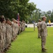 Passing the cutlass: senior enlisted sailor passes the sword in a change of charge ceremony