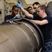 Sailors repair aircraft equipment