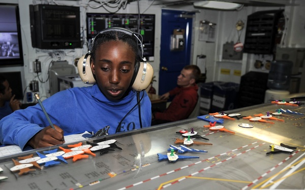 Sailor makes adjustments to flight deck control