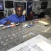 Sailor makes adjustments to flight deck control