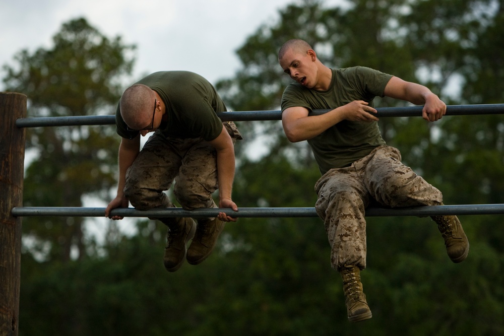 Recruits maneuver through obstacle course