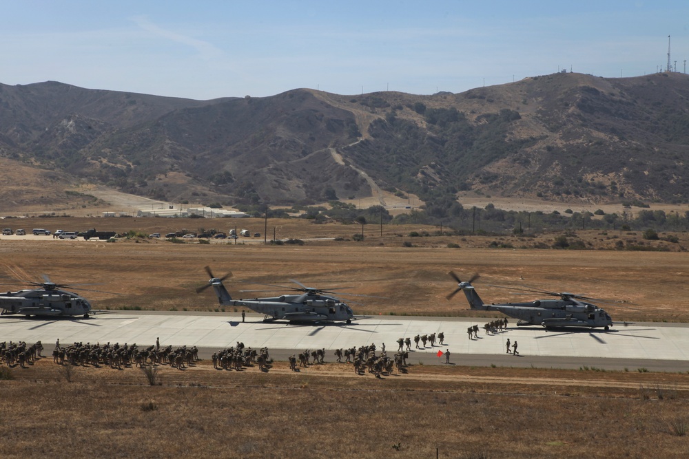 Marines board aircraft for an air assault training exercise for Dawn Blitz 2013