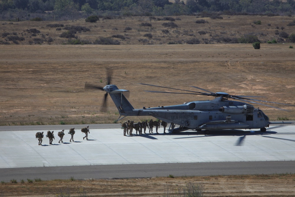 Marines board aircraft for an air assault training exercise for Dawn Blitz 2013