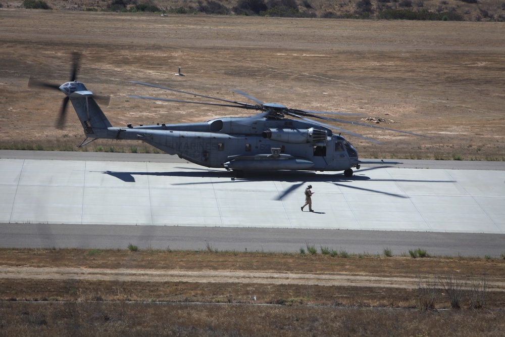 Marines board aircraft for an air assault training exercise for Dawn Blitz 2013