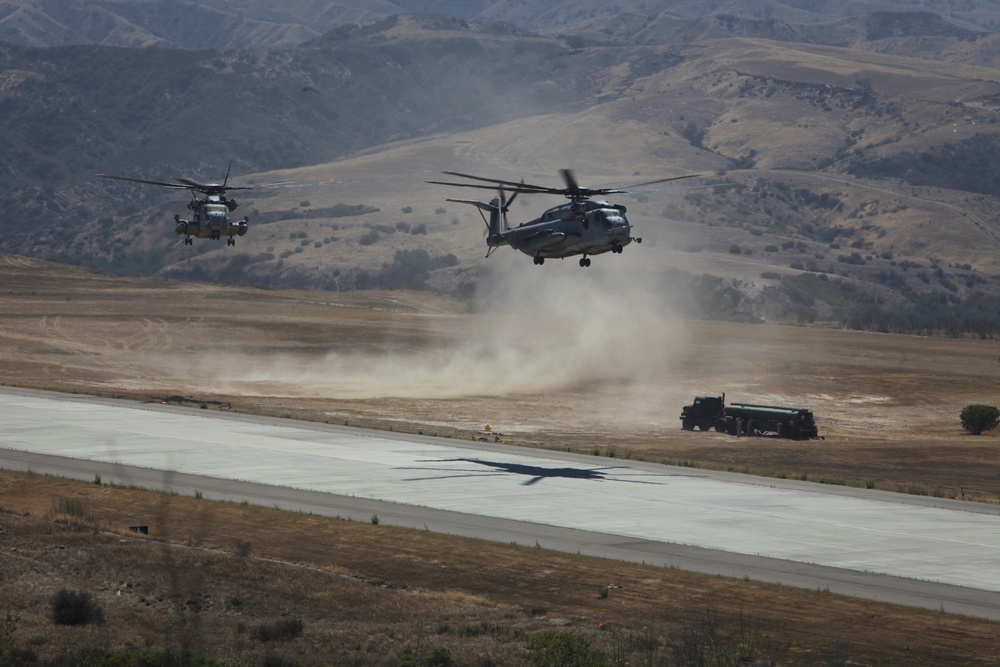 Marines board aircraft for an air assault training exercise for Dawn Blitz 2013