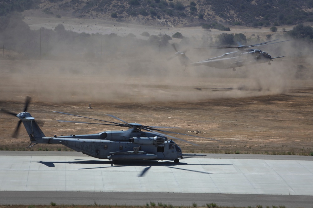 Marines board aircraft for an air assault training exercise for Dawn Blitz 2013