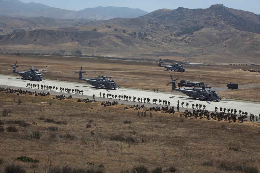 Marines board aircraft for an air assault training exercise for Dawn Blitz 2013