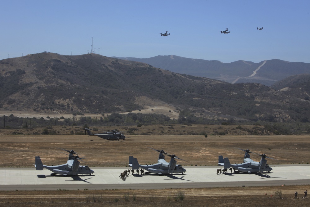 Marines board aircraft for an air assault training exercise for Dawn Blitz 2013