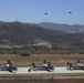 Marines board aircraft for an air assault training exercise for Dawn Blitz 2013