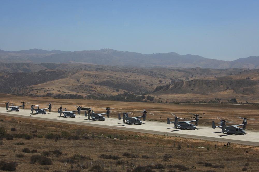 Marines board aircraft for an air assault training exercise for Dawn Blitz 2013