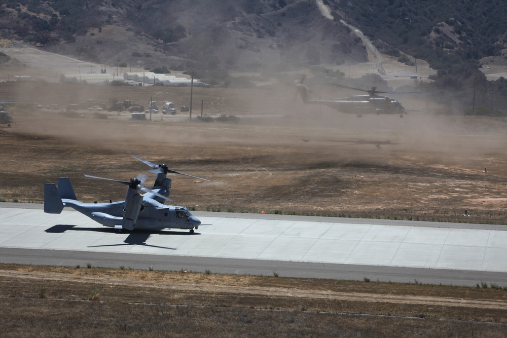 Marines board aircraft for an air assault training exercise for Dawn Blitz 2013