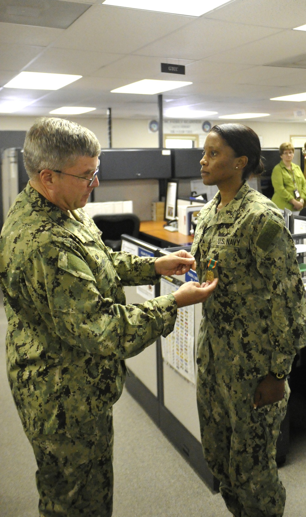Petty Officer 1st Class Felicia Williams receives the Navy and Marine Corps Achievement Medal