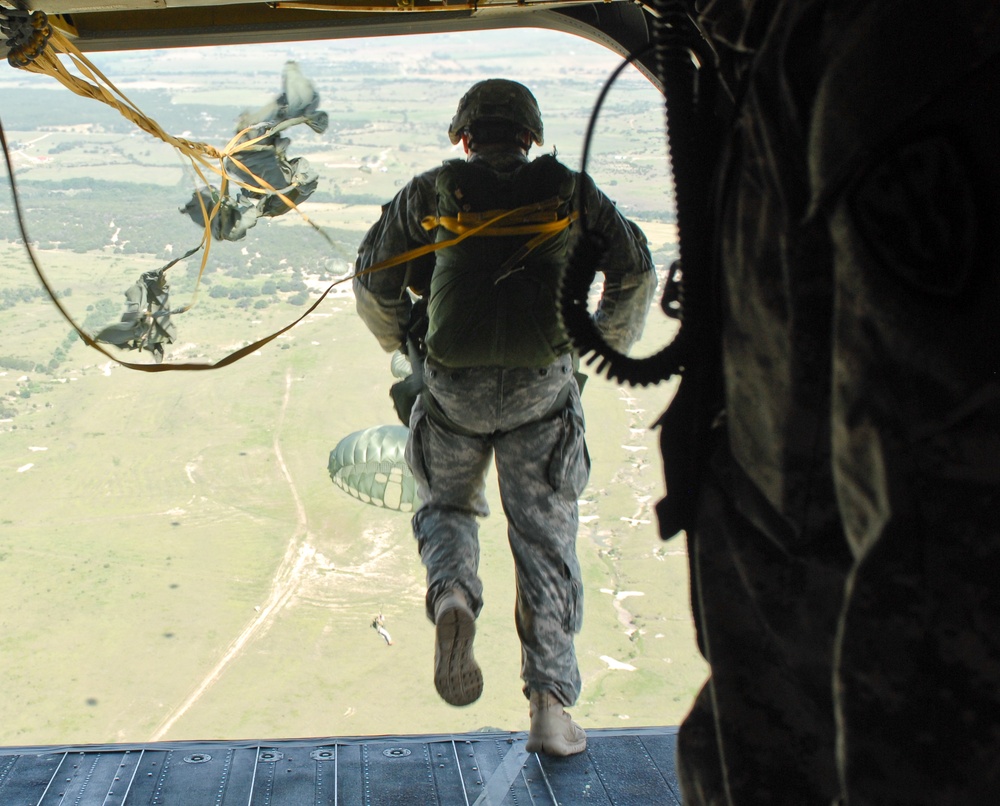 Hood paratroopers complete jump as families look on