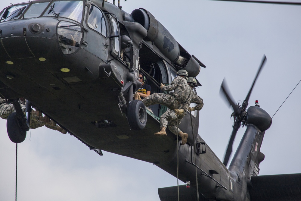 Cadets rappel from Guard Black Hawks