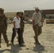 Joint senior logisticians walk disposition services yard in Bagram