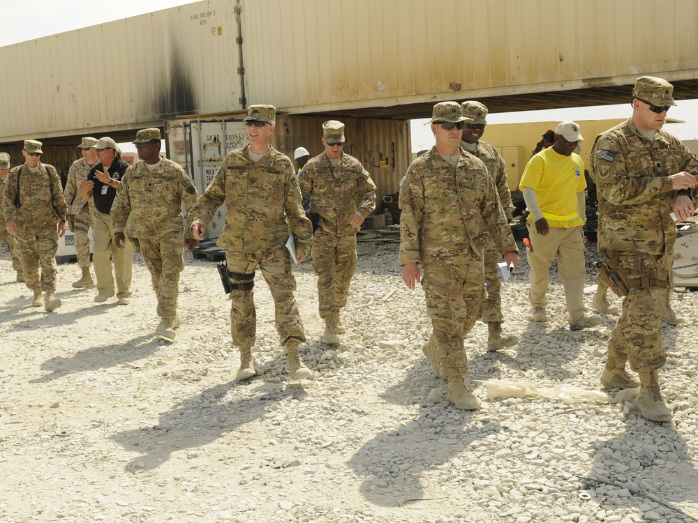Joint senior logisticians walk disposition services yard in Bagram
