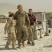Joint senior logisticians walk disposition services yard in Bagram
