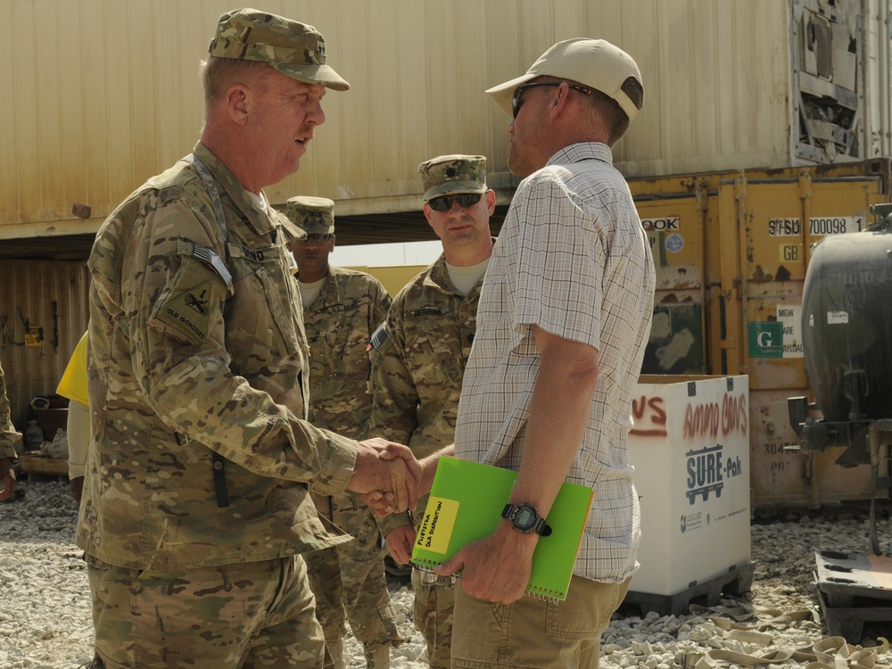 Joint senior logisticians walk disposition services yard in Bagram