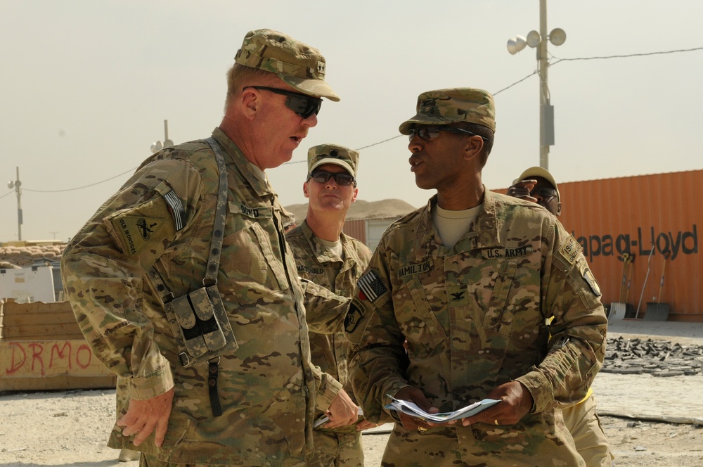 Joint senior logisticians walk disposition services yard in Bagram