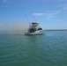 A fishing boat burns after CBP rescues 2