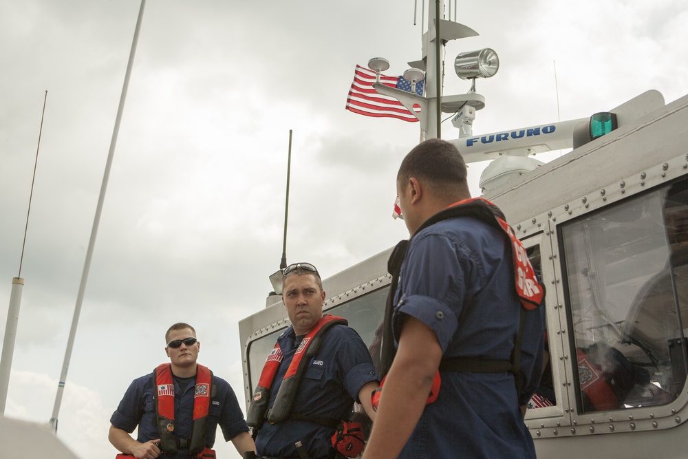 Boarding team members discuss their plans for operation dry water
