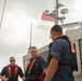 Boarding team members discuss their plans for operation dry water