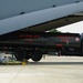 Airmen load refueling trucks onto aircraft