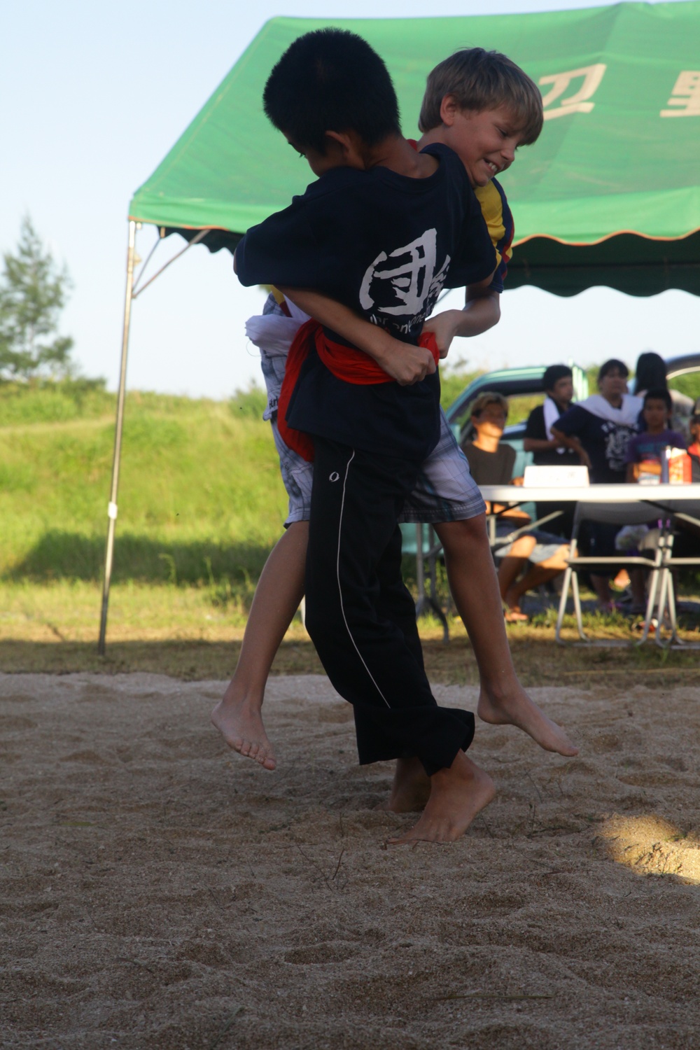 Pseudo-sumo wrestlers test their might in contest