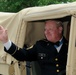 Medal of Honor recipient waves to the crowd at Independence Day parade