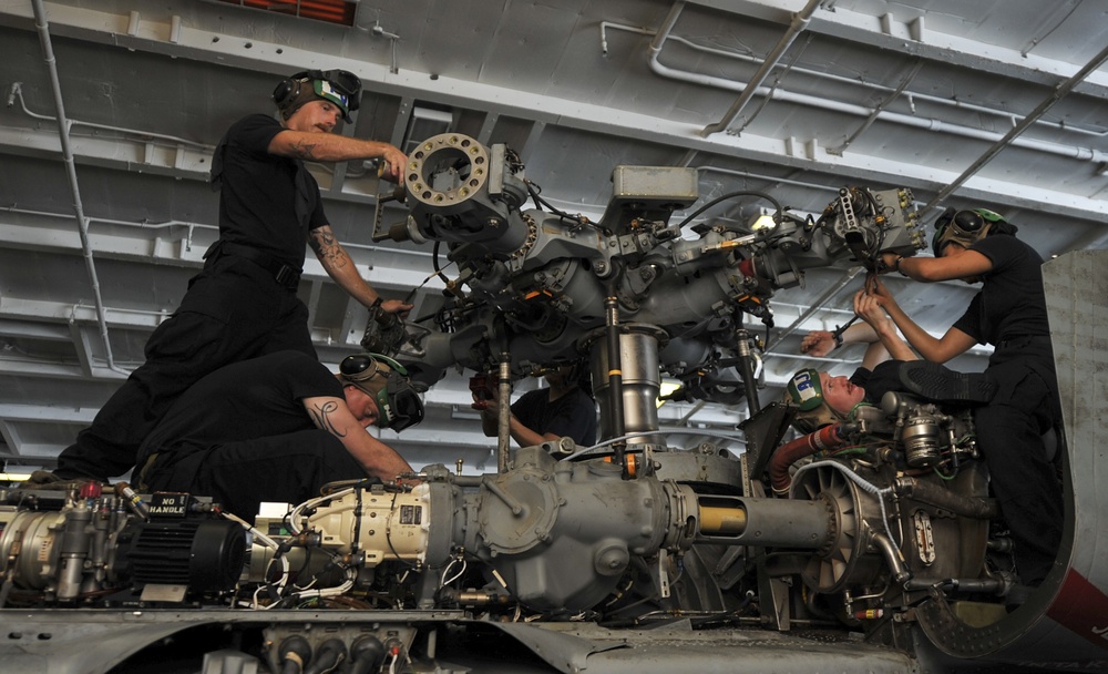 Maintenance on an MH-60S Sea Hawk helicopter