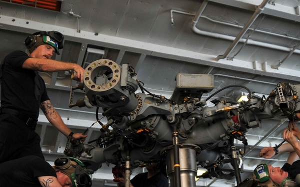 Maintenance on an MH-60S Sea Hawk helicopter