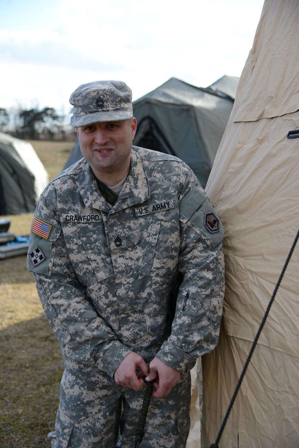 DVIDS - Images - Sgt. 1st Class Billy Crawford secures the tent with a taut  line hitch knot [Image 19 of 20]
