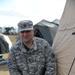 Sgt. 1st Class Billy Crawford secures the tent with a taut line hitch knot