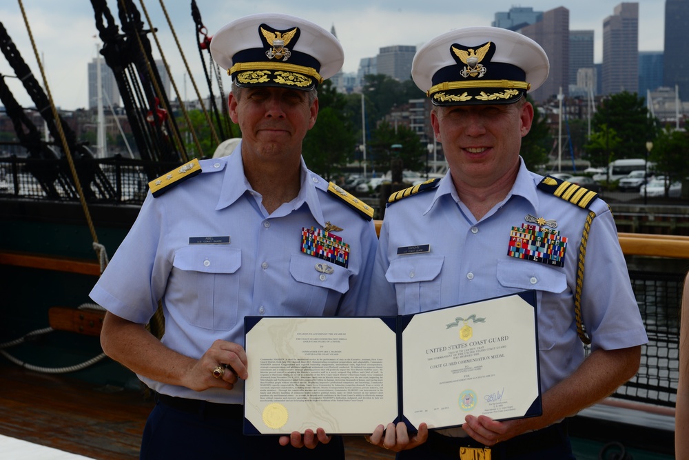 Coast Guard commander promoted to captain on Navy Ship