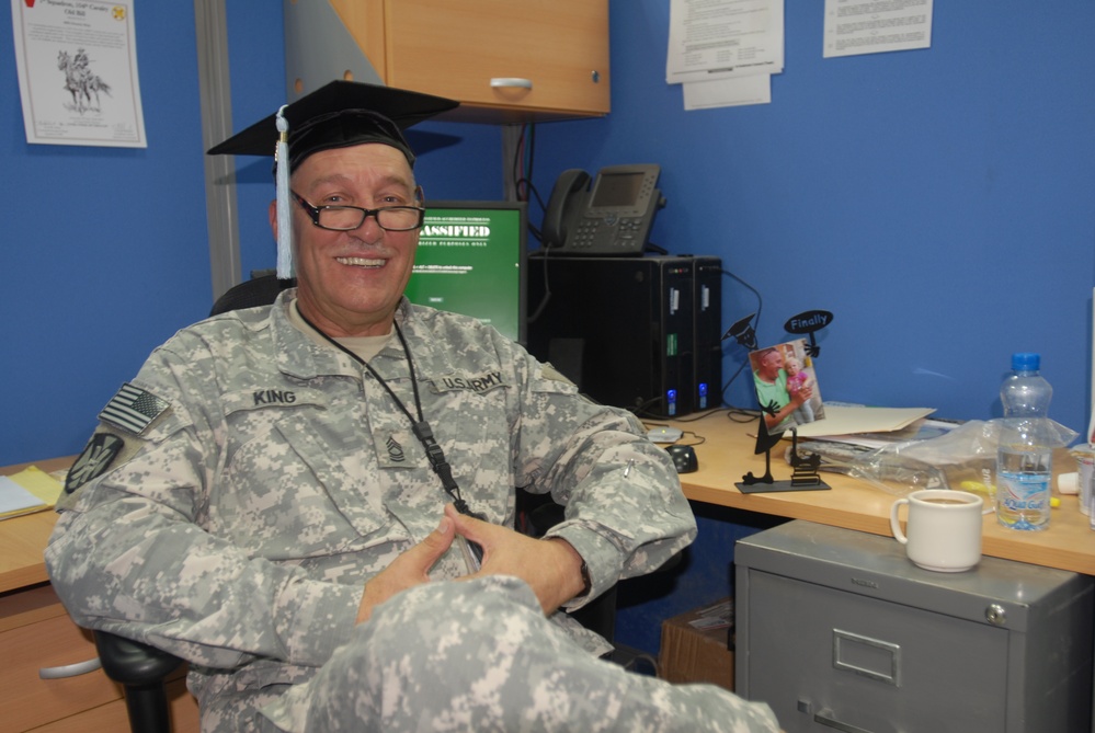 Deployed soldier receives doctorate
