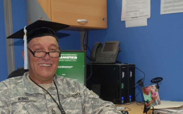 Deployed soldier receives doctorate
