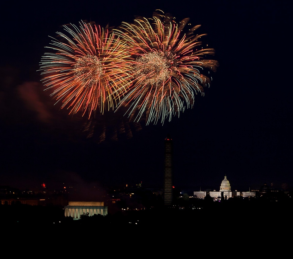 Larger base fireworks crowd, 50-gun salute highlight holiday