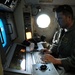 Naval aircrewman performs preflight inspection