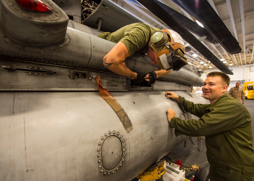 Marines remove fuel tank from helicopter