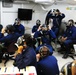 Sailors put on gas masks