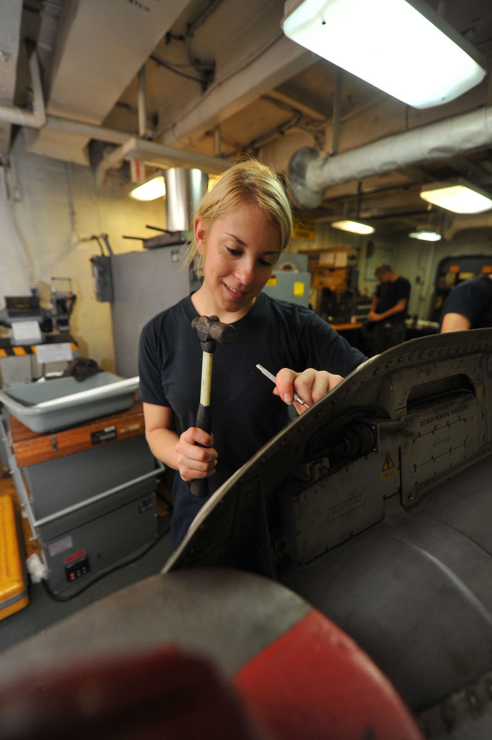 USS Nimitz sailor at work