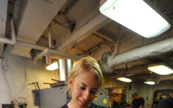 USS Nimitz sailor at work